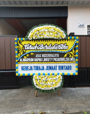 Papan Bunga Duka di Tiro Sompe